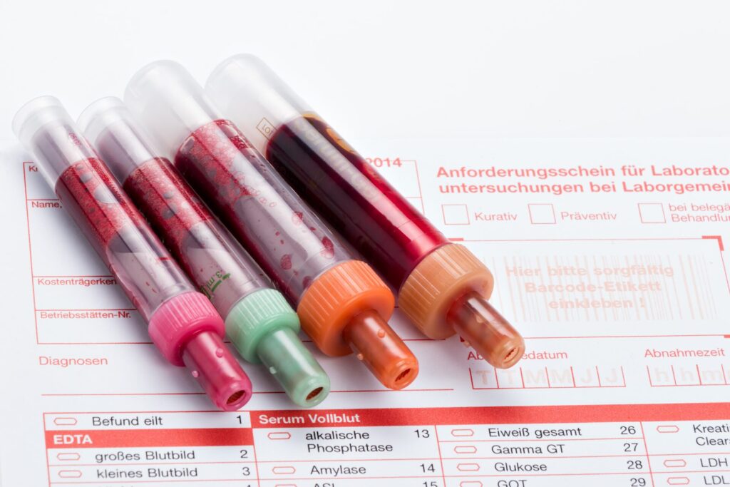 close up blood bottles paper with text min