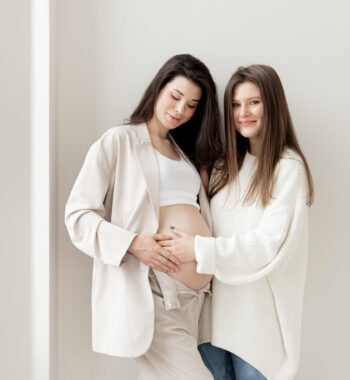 stylish pregnant brunette girl with beige trouser suit her friend min stylish pregnant brunette girl with beige trouser suit her friend min