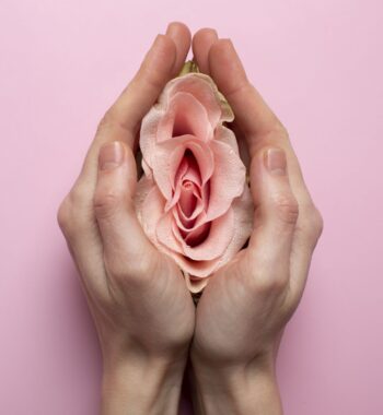 woman holding rose hands reproductive system visualization min woman holding rose hands reproductive system visualization min